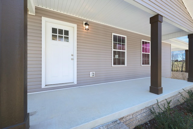 doorway to property featuring a porch