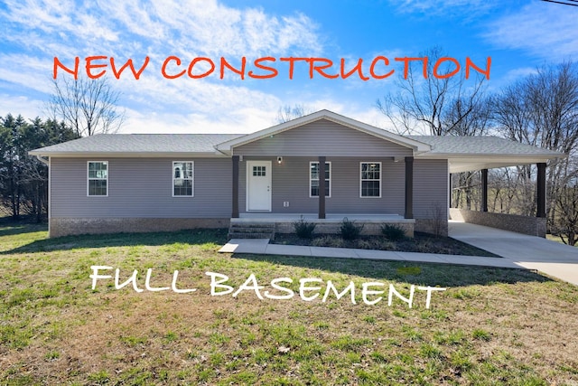 single story home with a carport, a porch, a front yard, and driveway