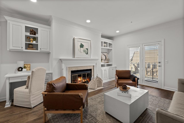 living room featuring crown molding, baseboards, dark wood-style flooring, and a high end fireplace