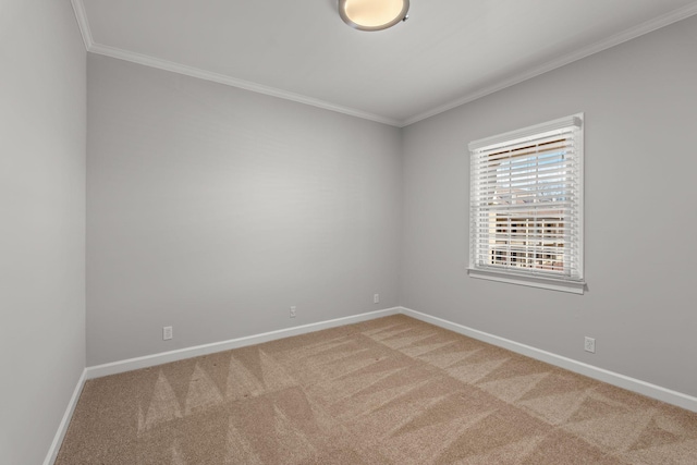 carpeted empty room with baseboards and ornamental molding