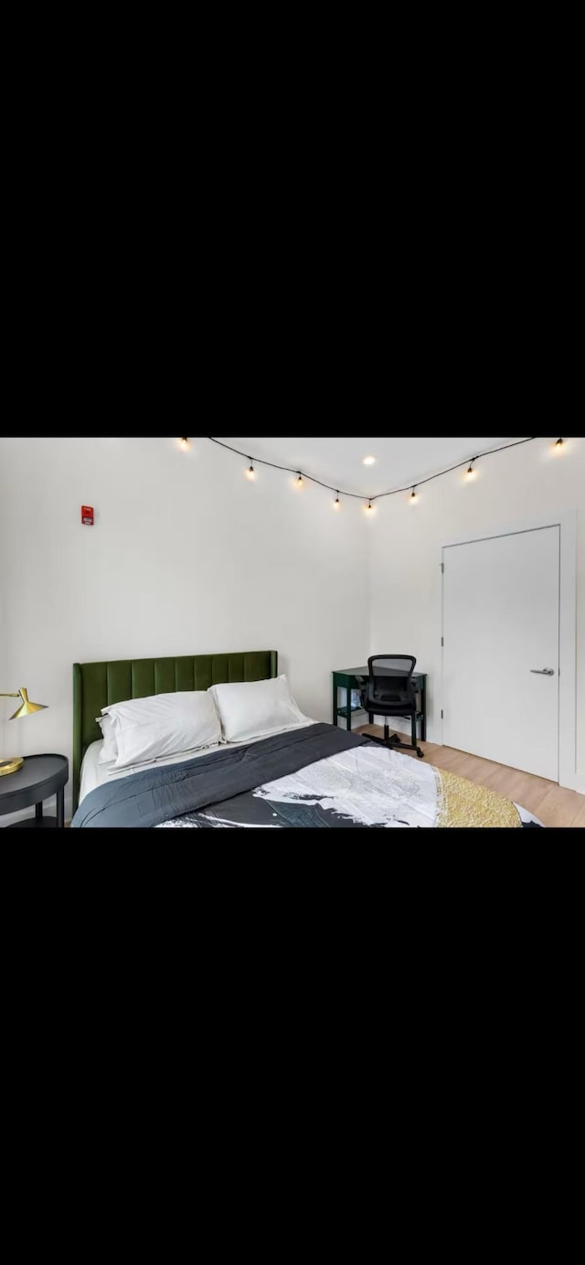 bedroom with wood finished floors