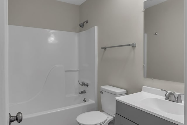 full bath with toilet, shower / bathing tub combination, and vanity