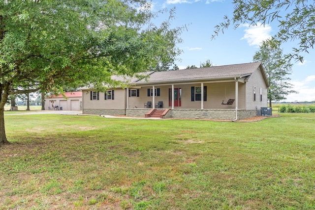 ranch-style house with a front lawn, crawl space, a porch, and a detached garage