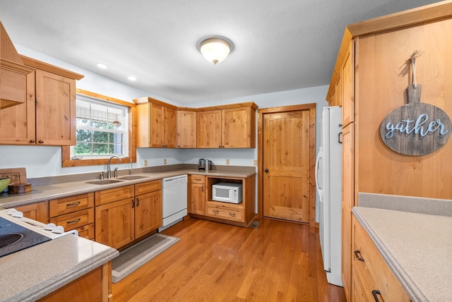 765 Heron Rd, Murray, KY 42071 - kitchen with recessed lighting, white appliances, a sink, light wood-style floors, and light countertops