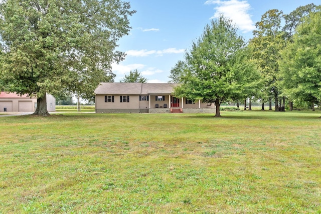 765 Heron Rd, Murray, KY 42071 - view of front of house with a detached garage and a front lawn