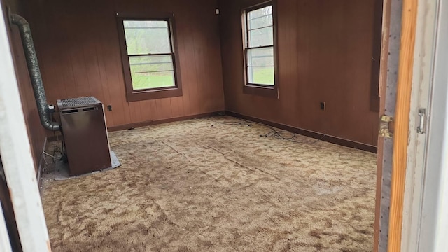 164 Willie Six Rd, Sewanee, TN 37375 - unfurnished room with baseboards, wood walls, and carpet