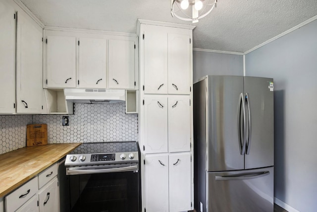 kitchen with stainless steel appliances, tasteful backsplash, butcher block counters, white cabinets, and under cabinet range hood