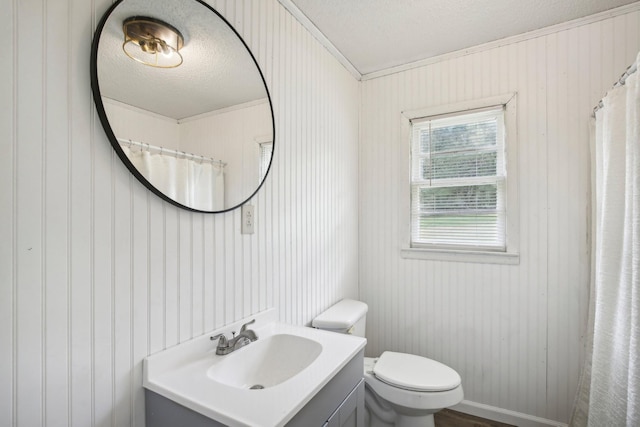 full bath with toilet, a textured ceiling, and vanity