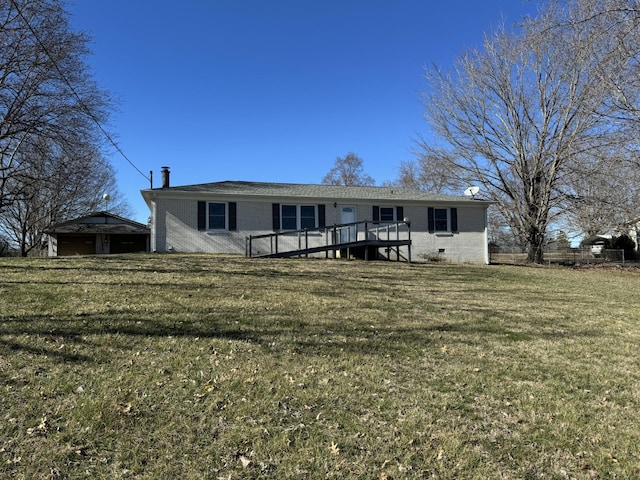 view of front of house with a deck, a front lawn, and brick siding