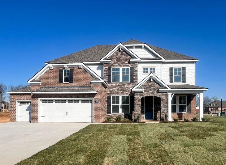 2706 Slatewood Way, Murfreesboro, TN 37129 - craftsman-style house featuring a front yard, a garage, stone siding, and concrete driveway