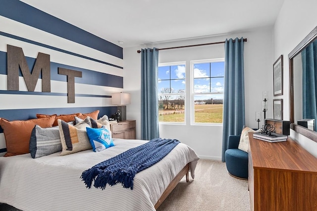 bedroom with carpet flooring and baseboards