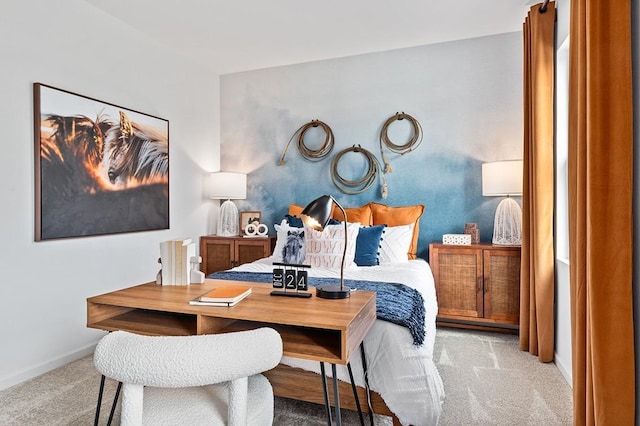 bedroom with light carpet and baseboards