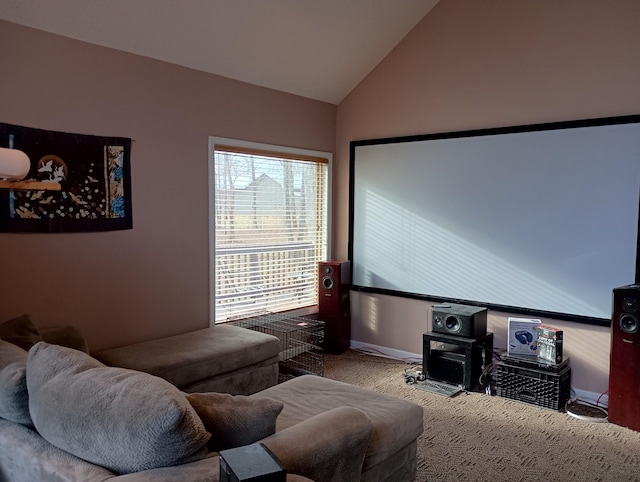 cinema featuring lofted ceiling, carpet flooring, and baseboards