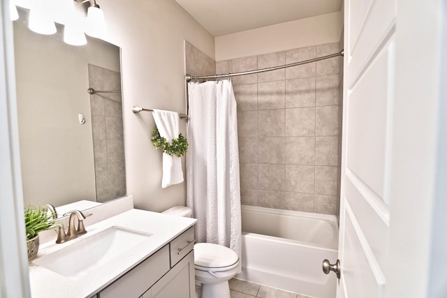 bathroom featuring shower / bath combination with curtain, vanity, toilet, and tile patterned floors