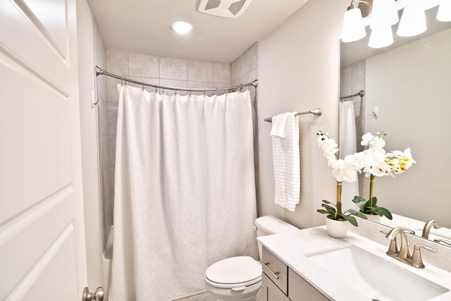 full bathroom with toilet and vanity