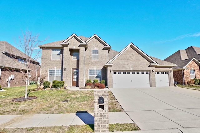 traditional home featuring a garage, a front lawn, concrete driveway, and brick siding