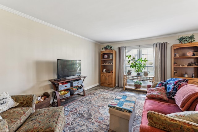 living room featuring baseboards, wood finished floors, and crown molding