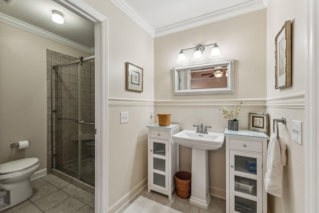 bathroom featuring toilet, visible vents, tile patterned floors, a stall shower, and crown molding