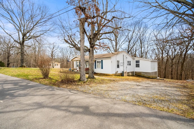 view of home's exterior featuring a chimney and cooling unit