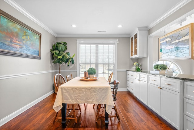 dining area with ornamental molding, recessed lighting, dark wood-type flooring, and baseboards