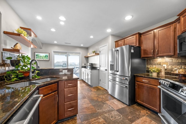 kitchen with recessed lighting, a sink, appliances with stainless steel finishes, open shelves, and tasteful backsplash