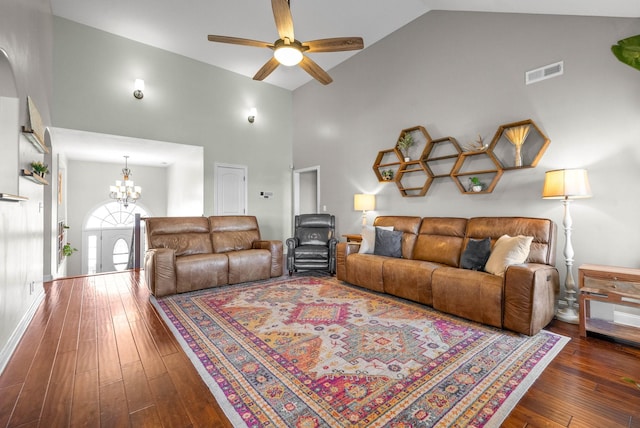 living area featuring ceiling fan with notable chandelier, high vaulted ceiling, wood-type flooring, and visible vents