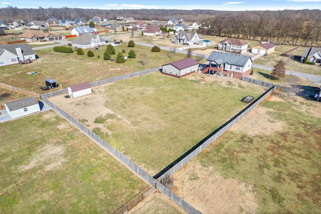 birds eye view of property with a residential view