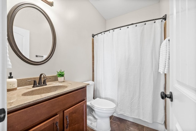 bathroom featuring vanity, toilet, and tile patterned floors