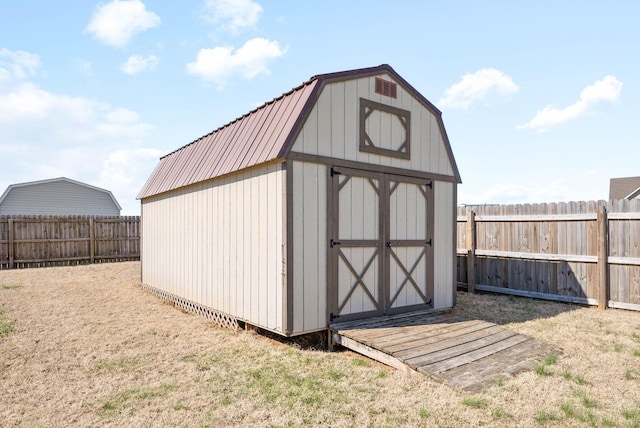 view of shed with a fenced backyard