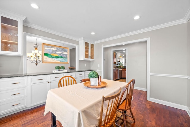 dining room with ornamental molding, dark wood finished floors, and recessed lighting