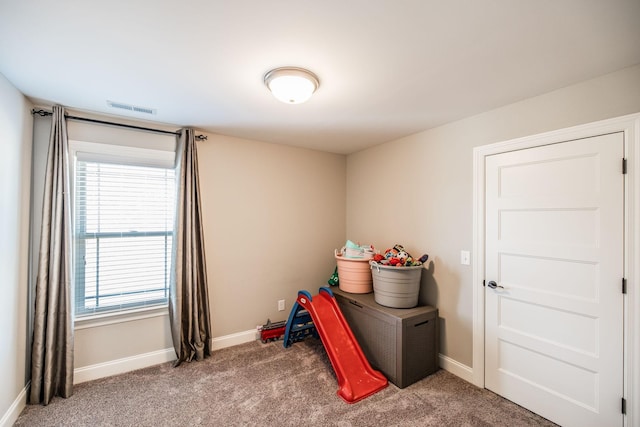 game room with baseboards, visible vents, and carpet flooring