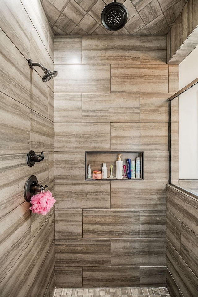 full bathroom with tiled shower