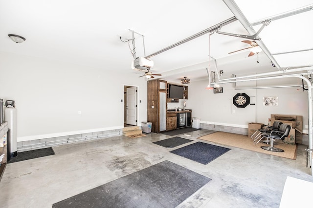 garage featuring a garage door opener and ceiling fan