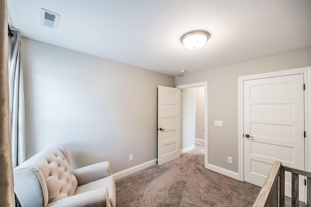 sitting room featuring carpet floors, baseboards, and visible vents