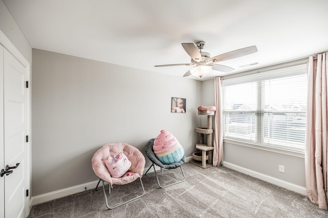 unfurnished room with ceiling fan, carpet, visible vents, and baseboards