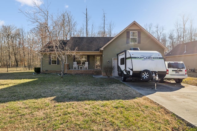 view of front of property featuring concrete driveway, covered porch, roof with shingles, and a front lawn