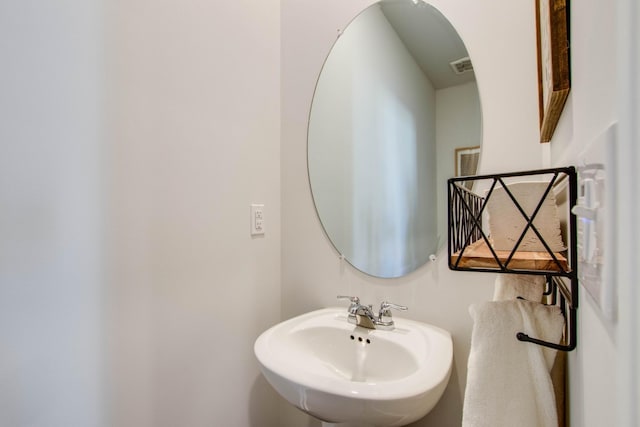 bathroom with a sink and visible vents