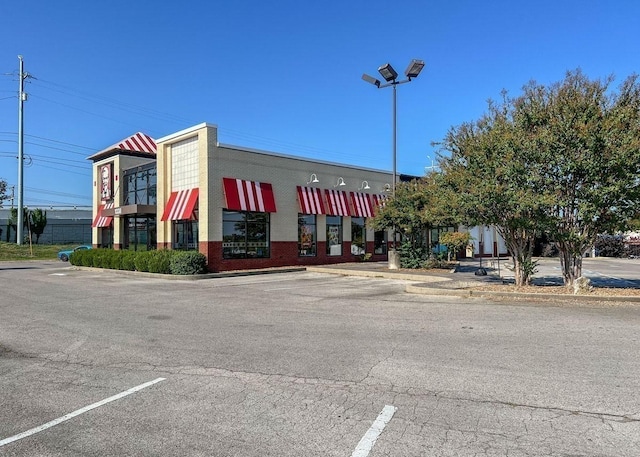 view of property featuring uncovered parking