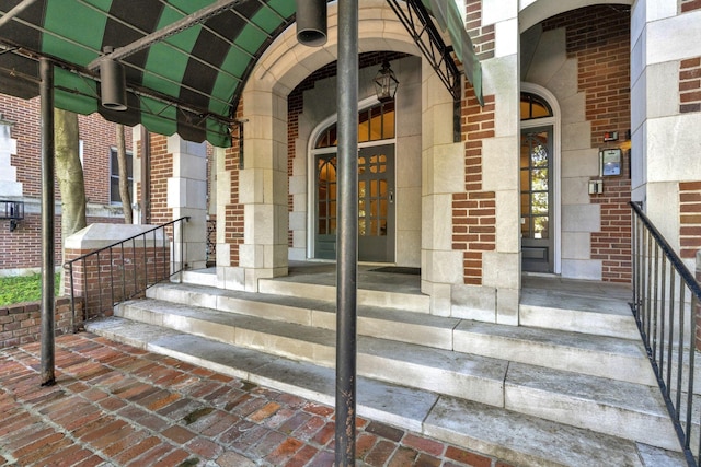 property entrance with brick siding