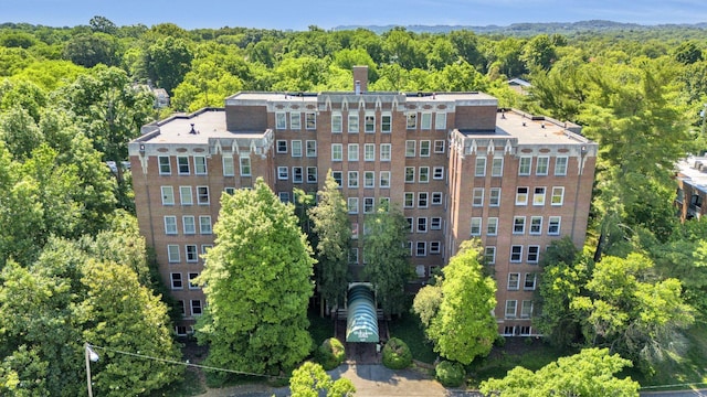 view of property with a forest view