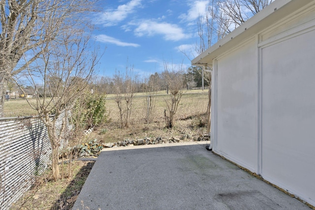 view of yard featuring a patio and fence