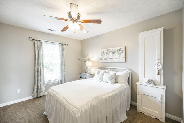 bedroom with baseboards, visible vents, a ceiling fan, a textured ceiling, and carpet flooring