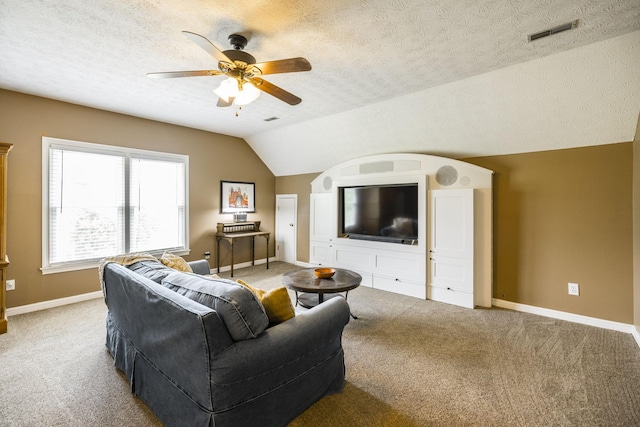 living area featuring light carpet, baseboards, visible vents, and lofted ceiling