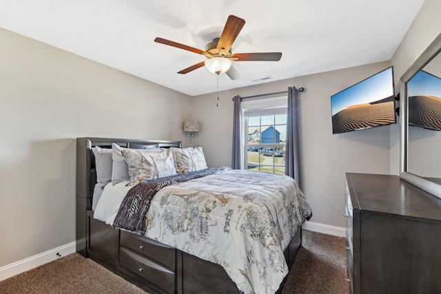 bedroom featuring a ceiling fan, dark colored carpet, visible vents, and baseboards