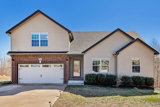 traditional-style house with a garage, a shingled roof, a front lawn, and concrete driveway