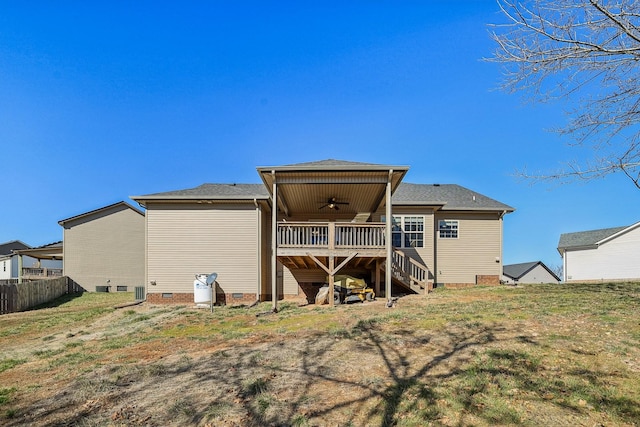 rear view of house with fence, a ceiling fan, stairs, a yard, and crawl space