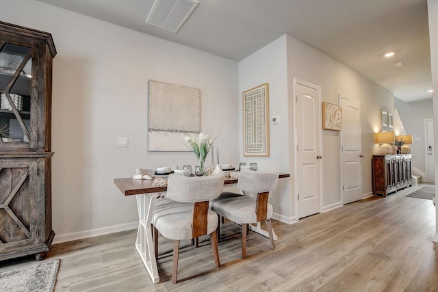 dining area featuring light wood-style flooring, visible vents, baseboards, and recessed lighting