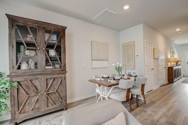 dining area featuring light wood-style floors, recessed lighting, and baseboards