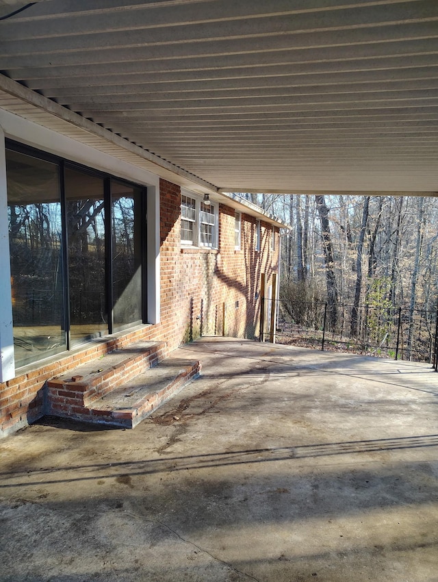 view of patio featuring fence