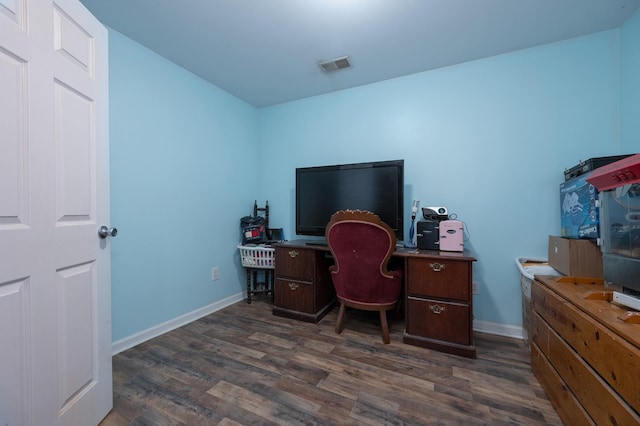 home office featuring baseboards, visible vents, and dark wood-style flooring